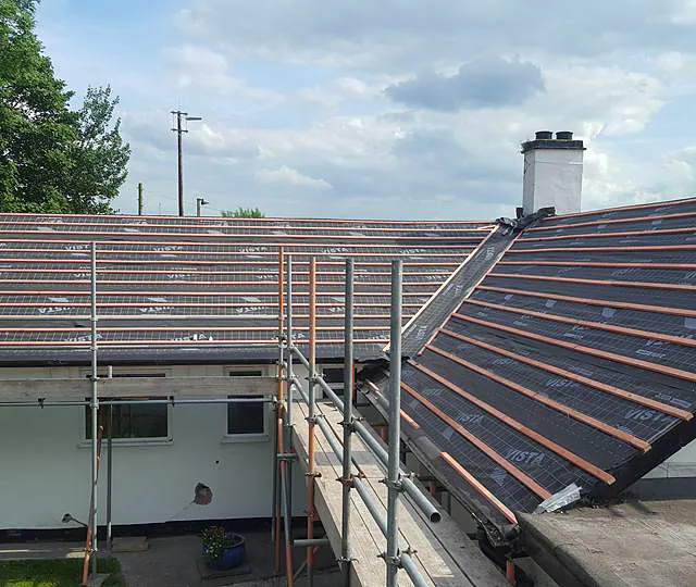 View of the progress of a new roof for a residential home