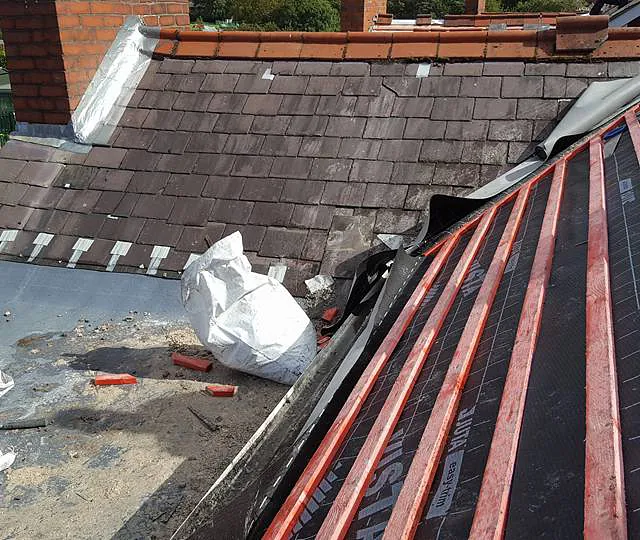 our team completing a re-roofing task