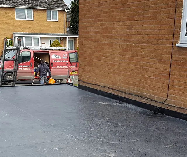 View of a flat roof that has been added to a home